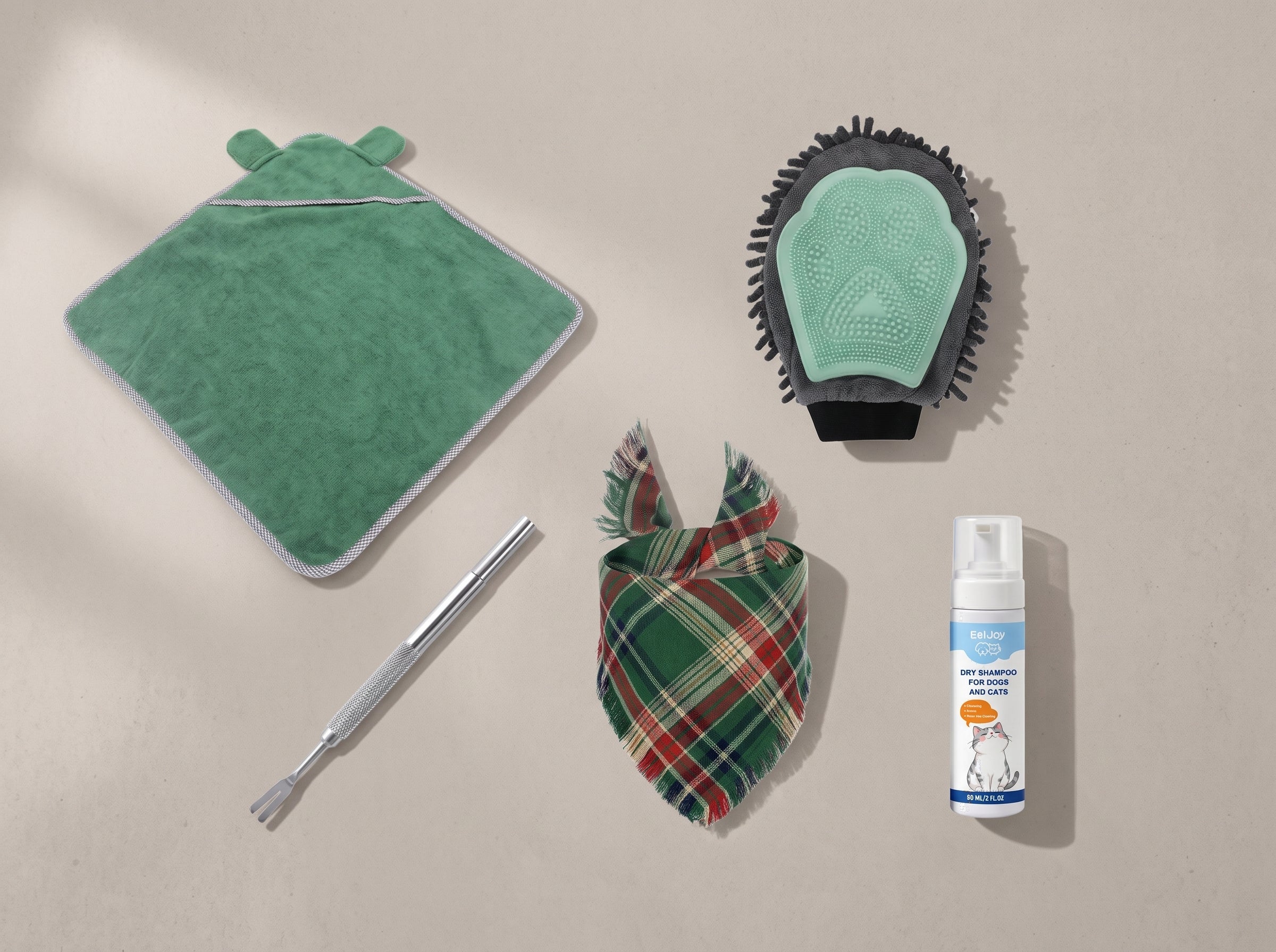 The five pieces of The After Walk Kit laid out together: green
              hooded drying towel, bath and grooming glove, green tartan
              bandana, stainless tick remover and a 60ml no-rinse foam